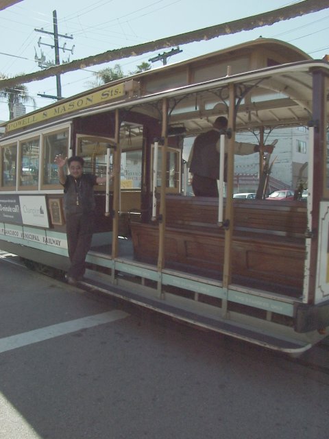 Typical cable car in action with typical weird guy in action