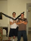 Mike and Kevin sporting Airsoft shotguns and handguns