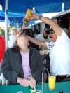 Melinda performs the time-honored and ancient ritual of drinking the holy water of Tijuana.